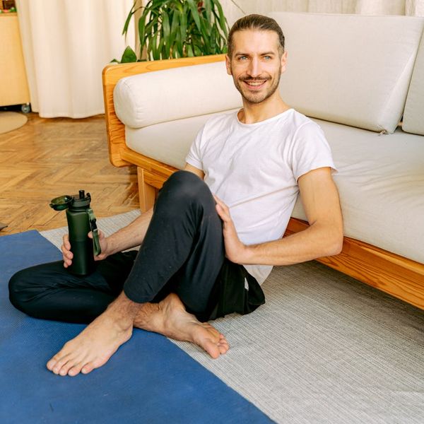 Yoga essentials like a mat, water bottle, and comfortable clothes.